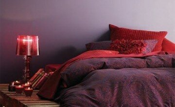 very romantic bedroom design with red tones and candles
