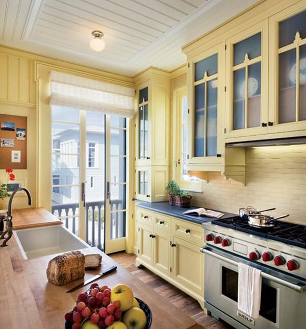 soft yellow colored kitchen cabinets